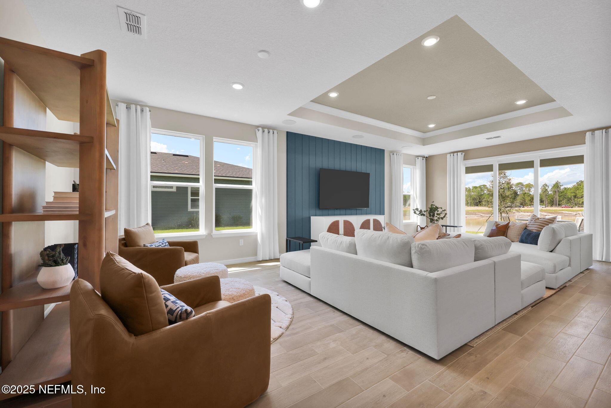 963 Floco Avenue Yulee, FL 32097 - Photo 9 of 47 a living room with furniture and a large window
