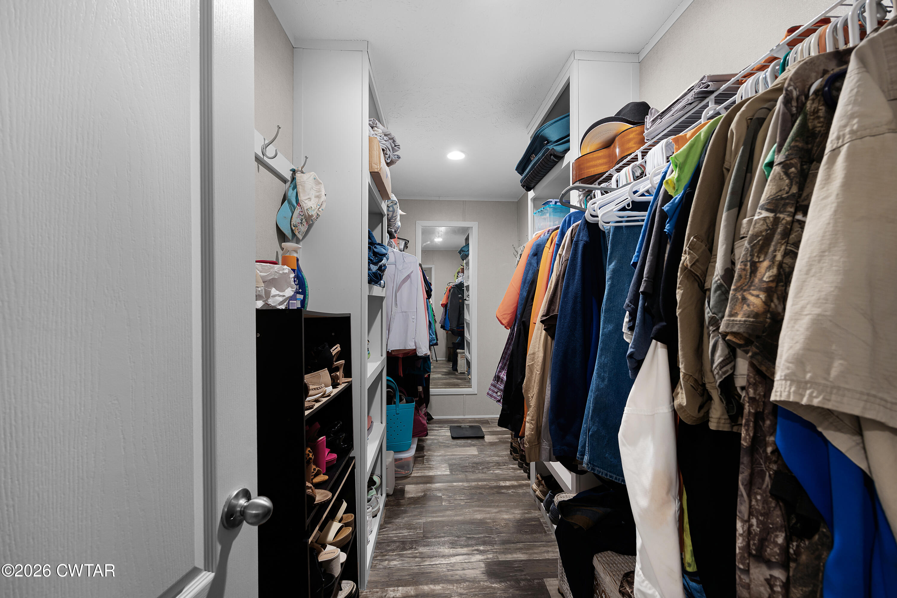 77 Vernon White Road Bradford, TN 38316 - Photo 11 of 24 a view of walk in closet with clothes and shoes