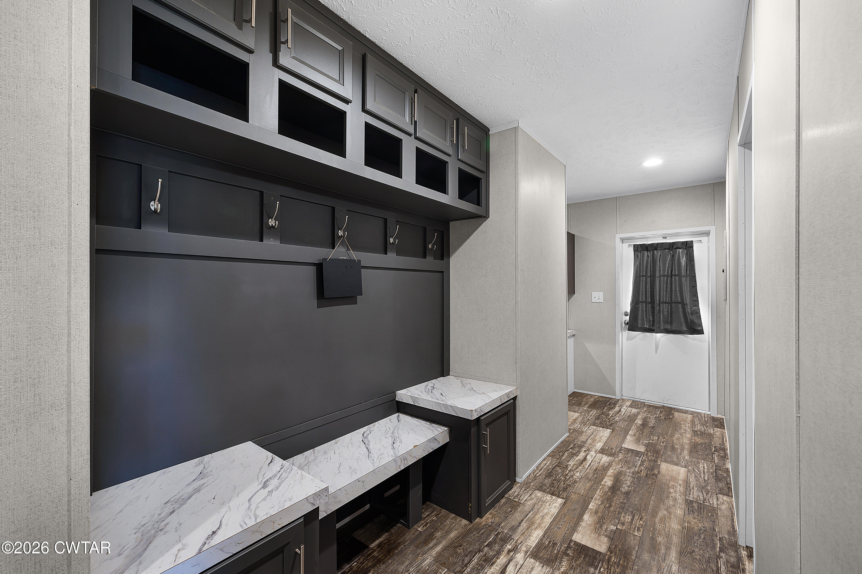 77 Vernon White Road Bradford, TN 38316 - Photo 16 of 24 a view of a hallway with seating area