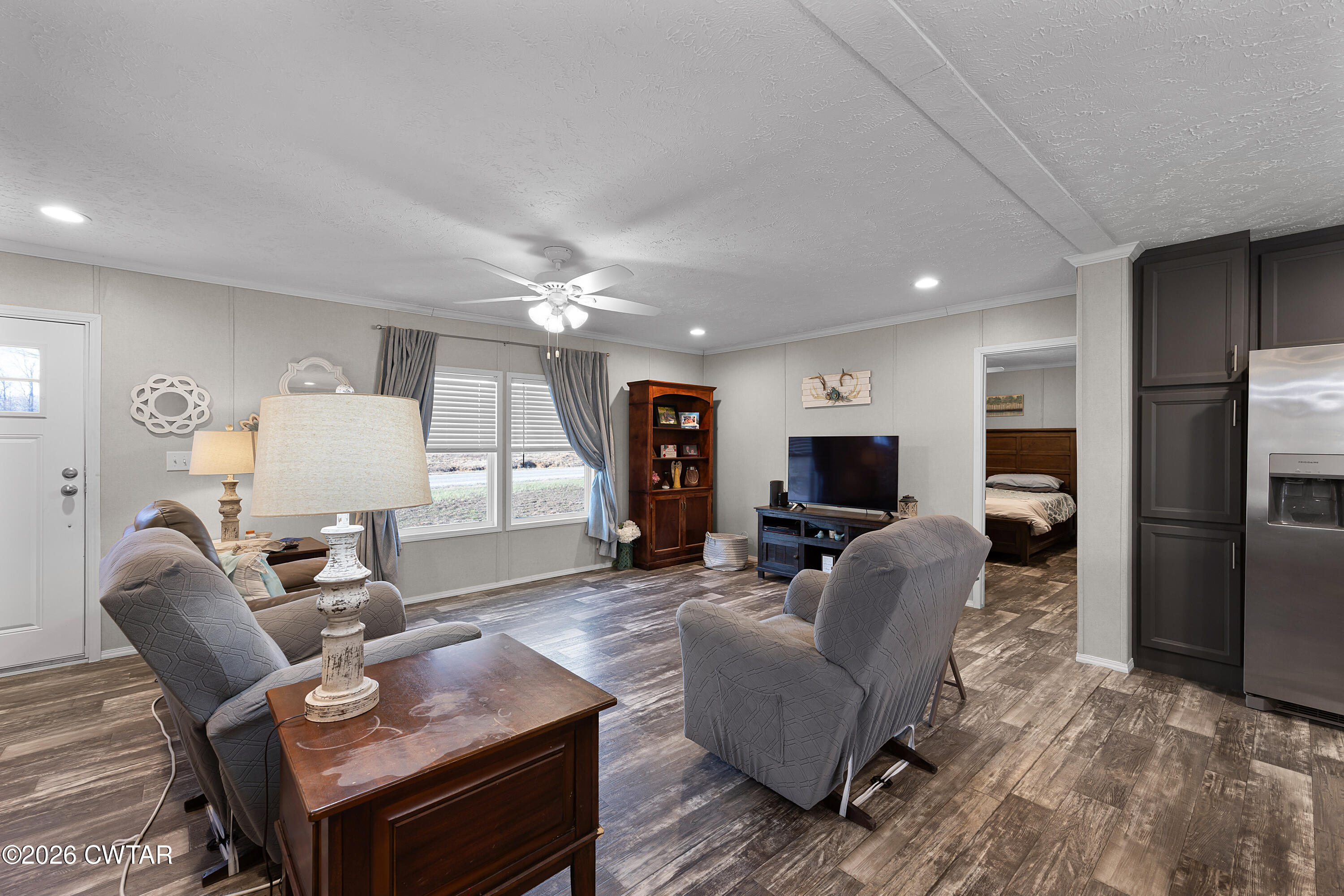 77 Vernon White Road Bradford, TN 38316 - Photo 3 of 24 a living room with furniture and a flat screen tv