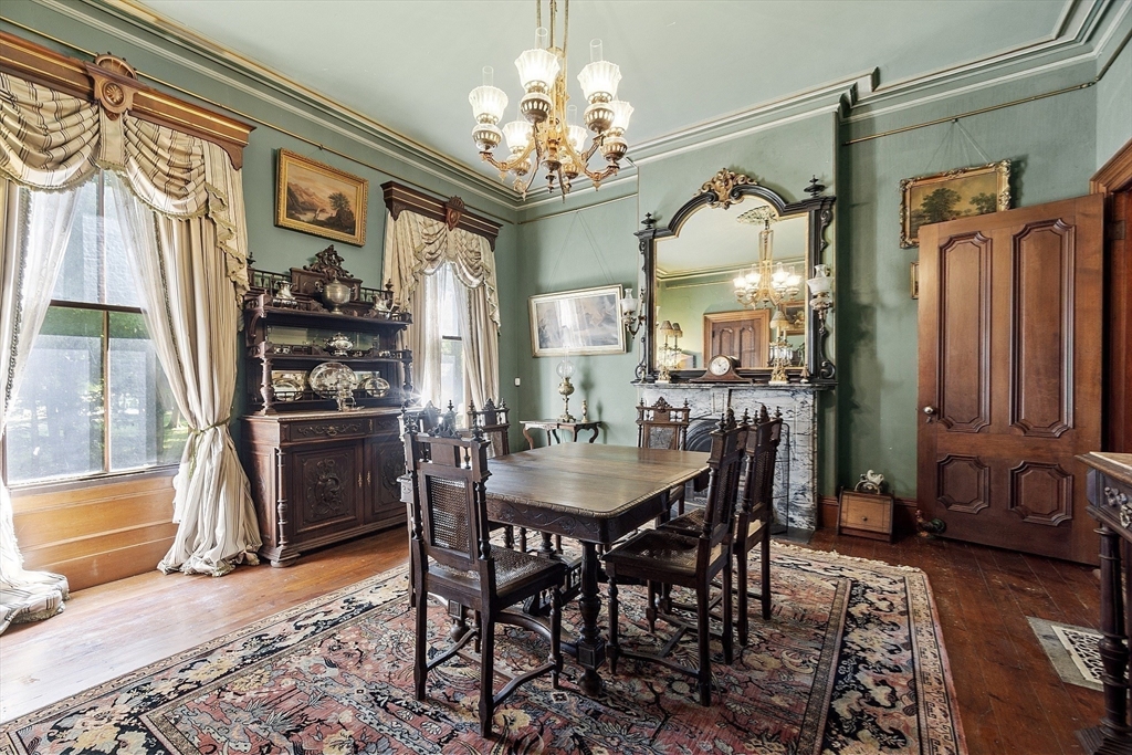 2 West Main Street Brookfield, MA 01506 - Photo 20 of 42 a view of a dining room with furniture and a chandelier