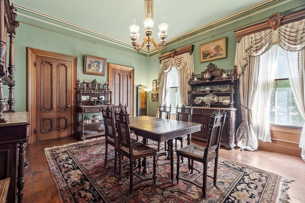 2 West Main Street Brookfield, MA 01506 - Photo 21 of 42 a view of a dining room with furniture and chandelier