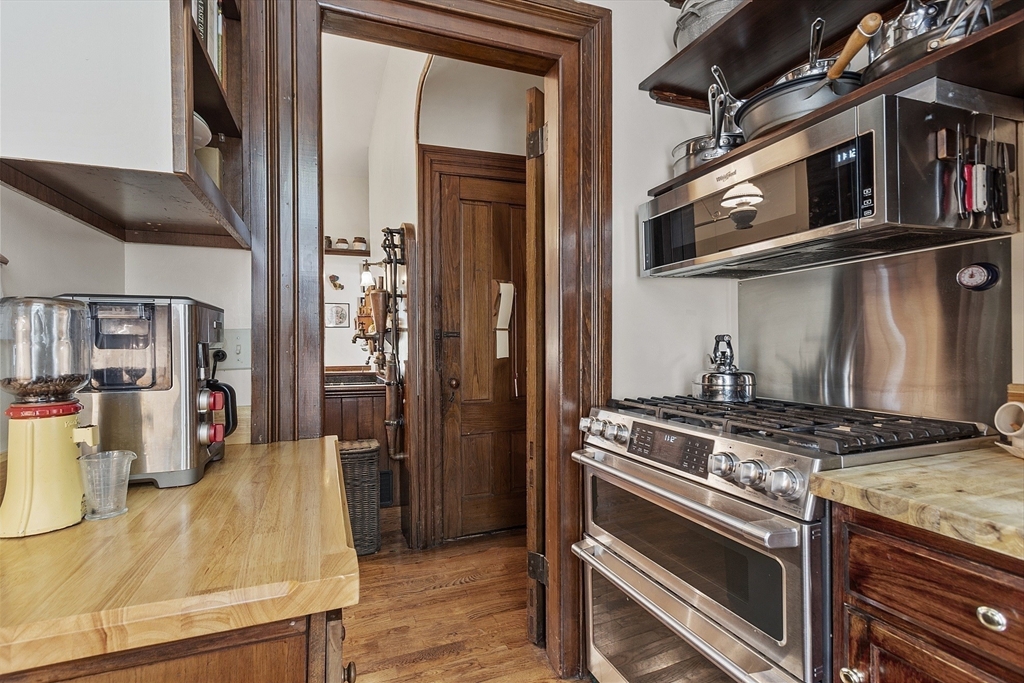 2 West Main Street Brookfield, MA 01506 - Photo 25 of 42 a kitchen with stainless steel appliances granite countertop a stove and a refrigerator