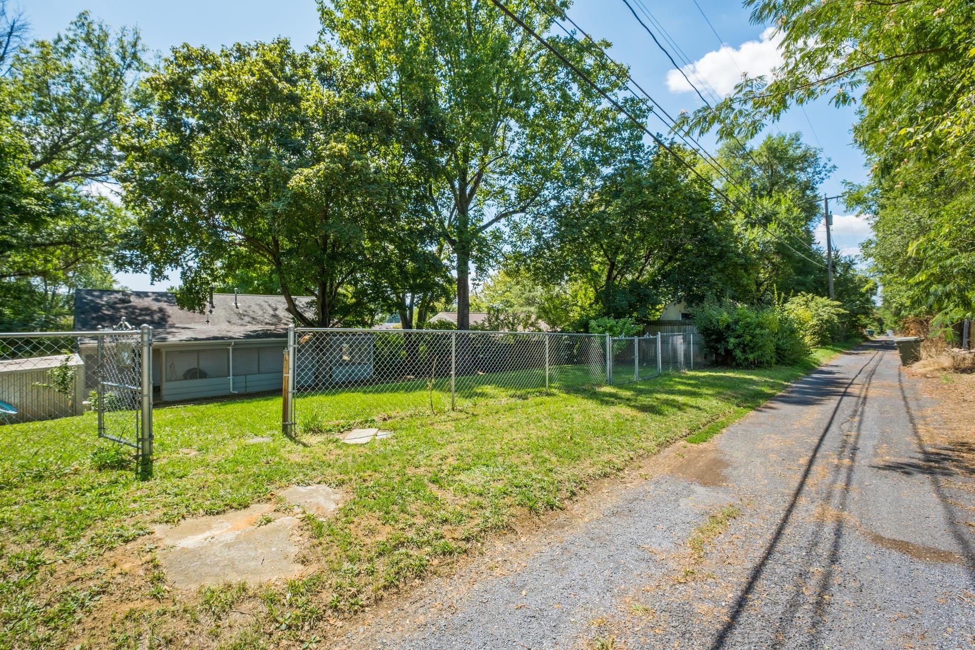 213 Link Road Waynesboro, VA 22980 - Photo 35 of 46 a backyard of a house with plants and large tree
