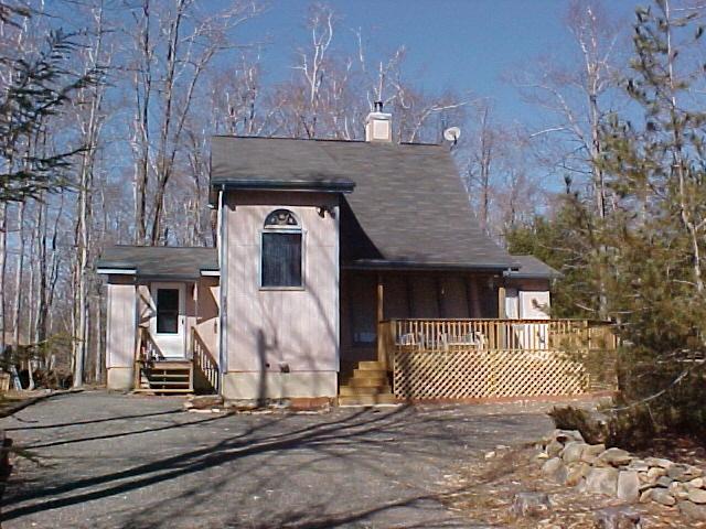 1138 Kilmer Road Tobyhanna, PA 18466 - Photo 1 of 15 a front view of a house with a garden