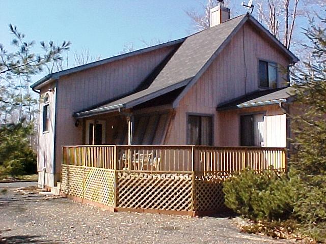 1138 Kilmer Road Tobyhanna, PA 18466 - Photo 3 of 15 a view of a house with a small yard and wooden fence