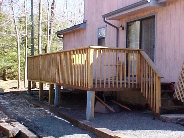 1138 Kilmer Road Tobyhanna, PA 18466 - Photo 4 of 15 a view of a house with a wooden deck