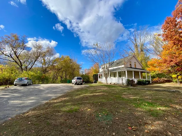 a view of a house with a yard