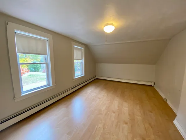 an empty room with a empty space and windows