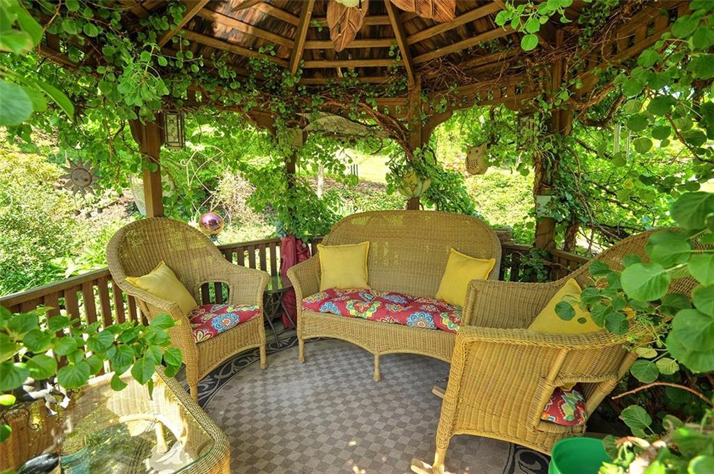 297 McClay Road Washington, PA 15301 - Photo 8 of 32 a roof deck with table and chairs and potted plants
