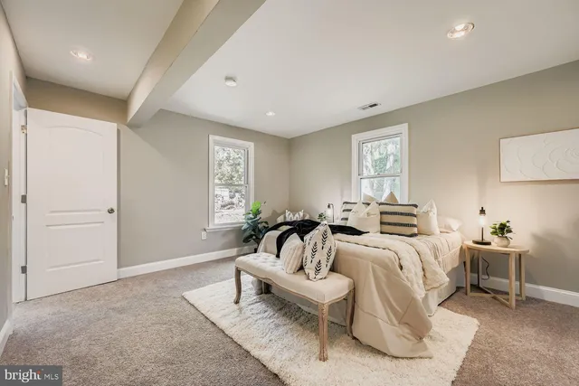 a bedroom with furniture and white walls