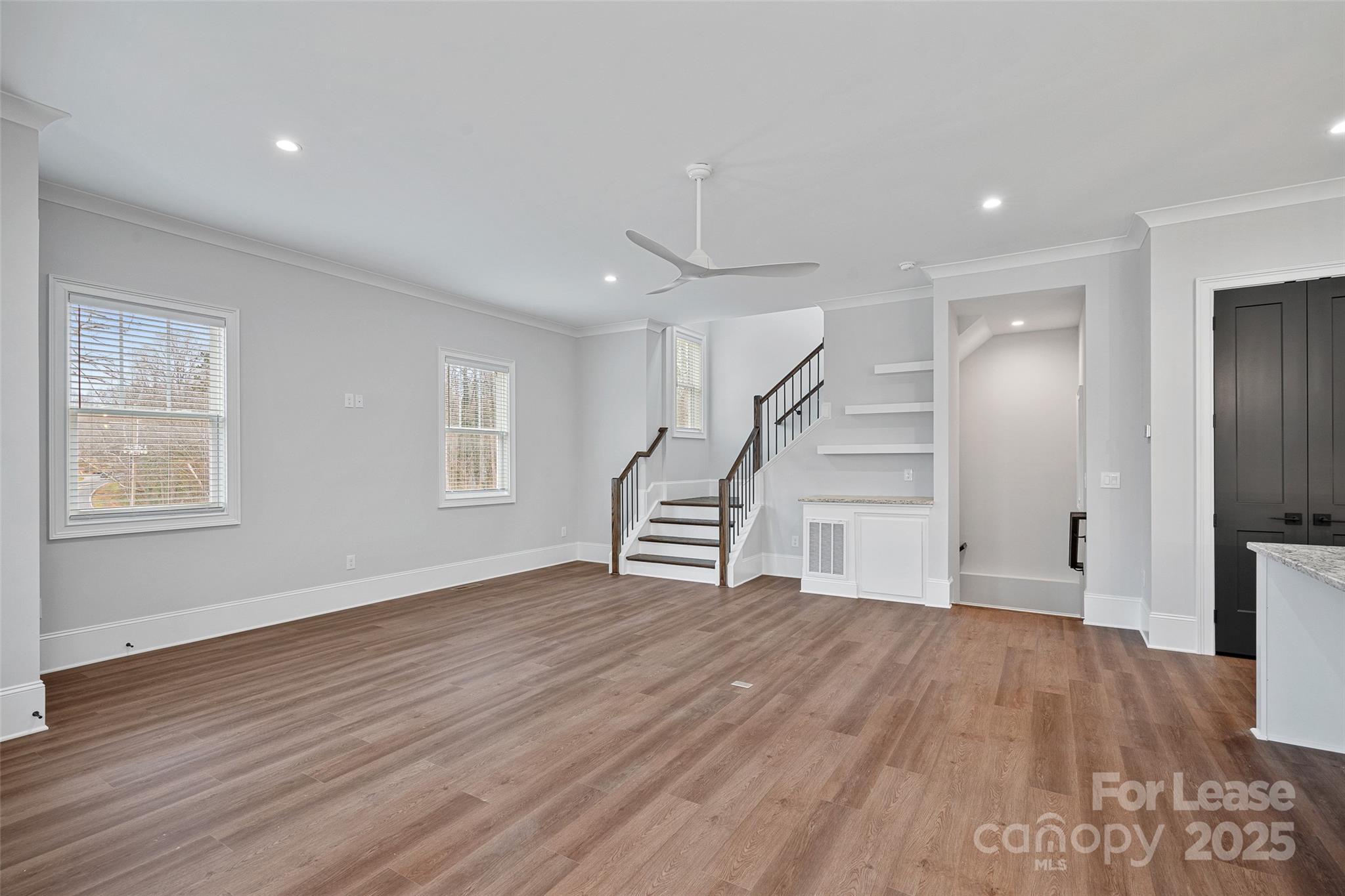 805 Naples Drive Davidson, NC 28036 - Photo 15 of 16 a view of empty room with wooden floor and window