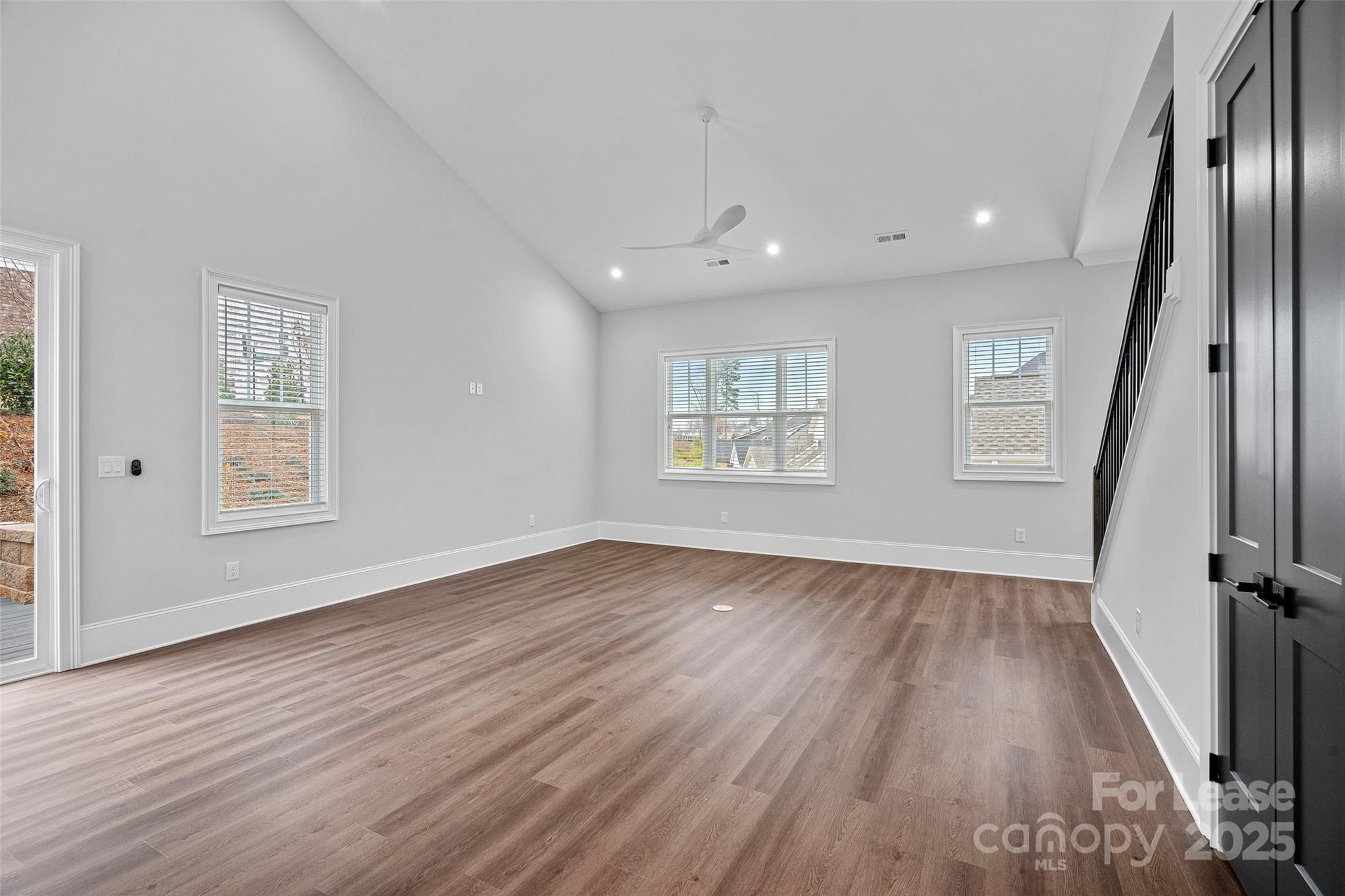 805 Naples Drive Davidson, NC 28036 - Photo 2 of 16 wooden floor in an empty room with a window