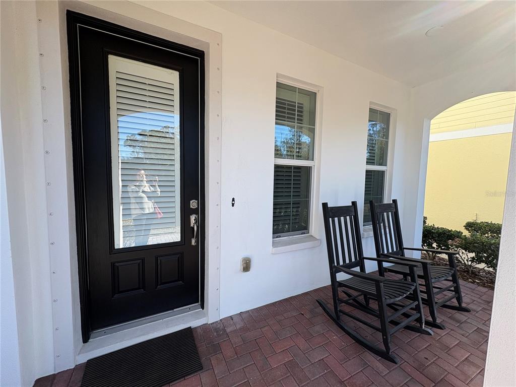 103 Cutlass Way Oldsmar, FL 34677 - Photo 4 of 20 a view of a livingroom with furniture and front door