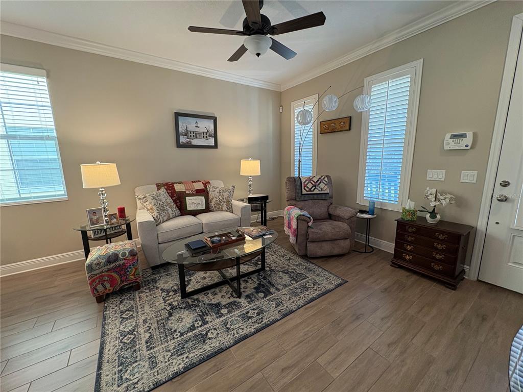 103 Cutlass Way Oldsmar, FL 34677 - Photo 8 of 20 a living room with furniture and wooden floor