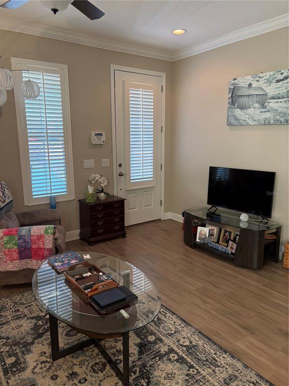 103 Cutlass Way Oldsmar, FL 34677 - Photo 9 of 20 a living room with furniture and a flat screen tv