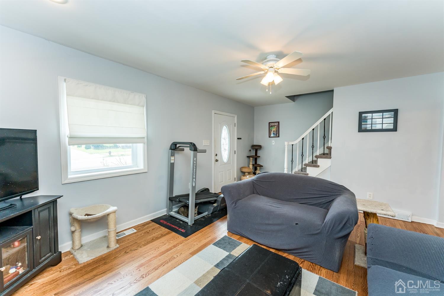 28 West Upper Ferry Road Ewing, NJ 08628 - Photo 3 of 19 a living room with furniture and a flat screen tv