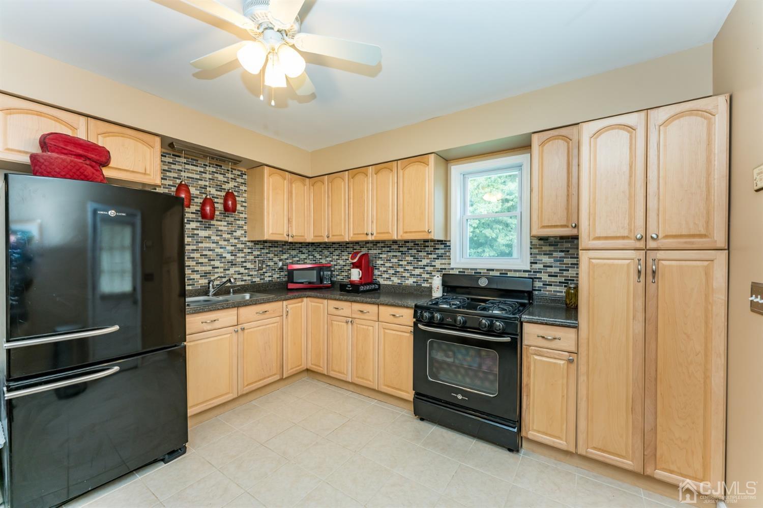28 West Upper Ferry Road Ewing, NJ 08628 - Photo 5 of 19 a kitchen with granite countertop a refrigerator oven a sink and dishwasher
