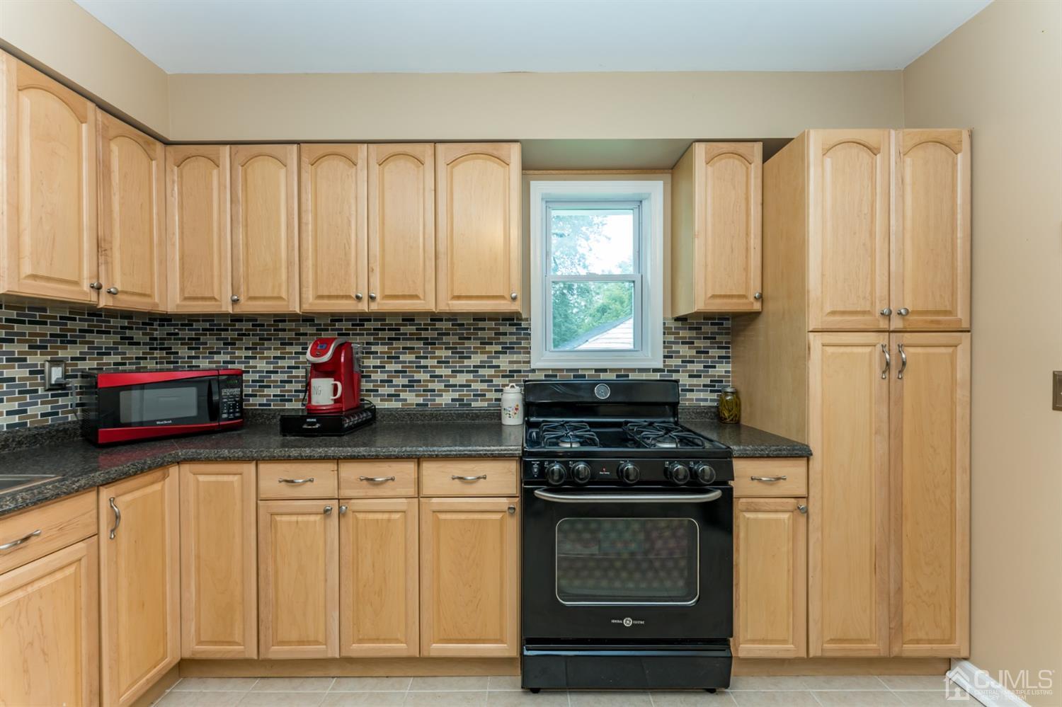 28 West Upper Ferry Road Ewing, NJ 08628 - Photo 6 of 19 a kitchen with stainless steel appliances a stove a sink and cabinets