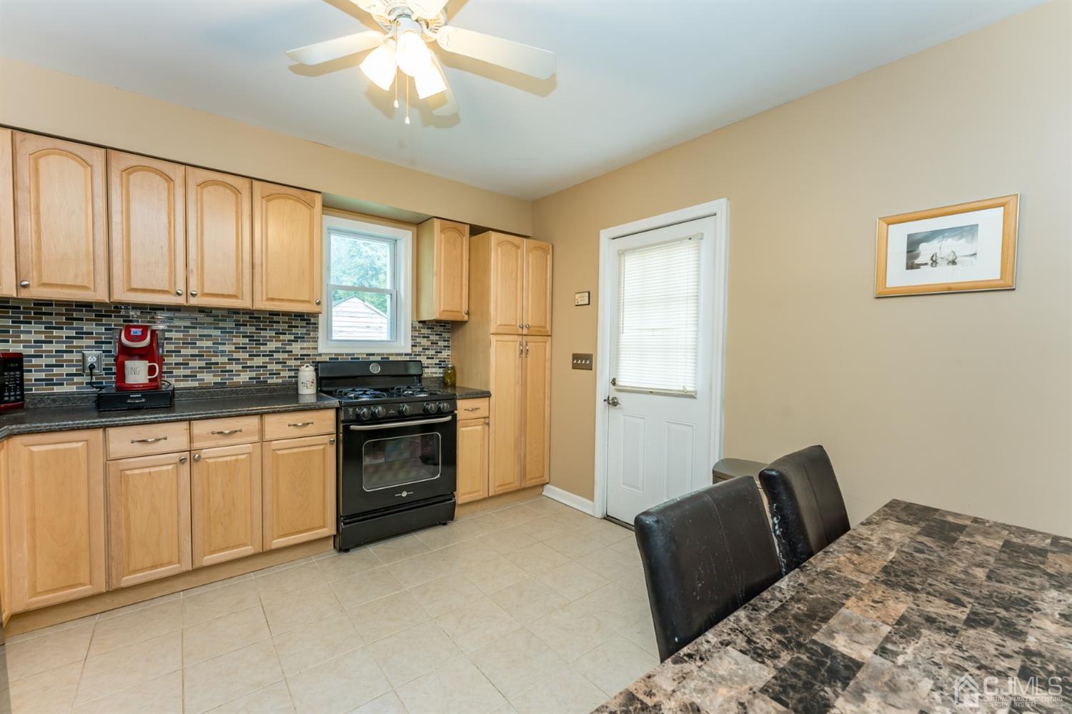 28 West Upper Ferry Road Ewing, NJ 08628 - Photo 8 of 19 a kitchen with a stove a sink and a refrigerator