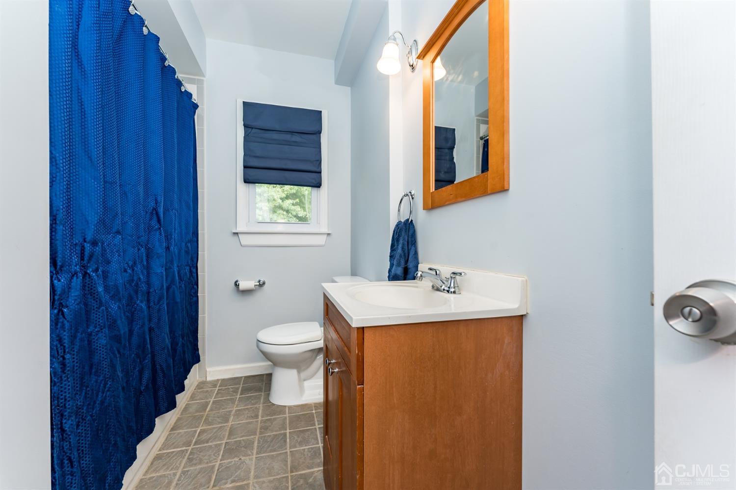28 West Upper Ferry Road Ewing, NJ 08628 - Photo 9 of 19 a bathroom with a toilet a sink and mirror