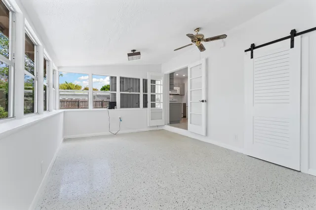 a view of an empty room with a window