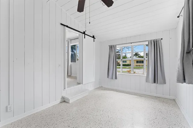 a view of a chandelier fan in a room