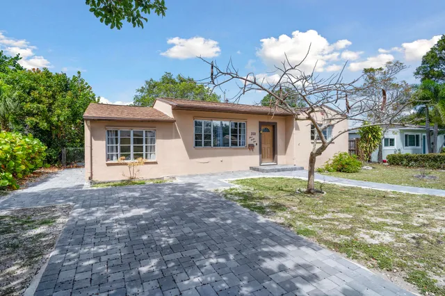 front view of a house with a yard