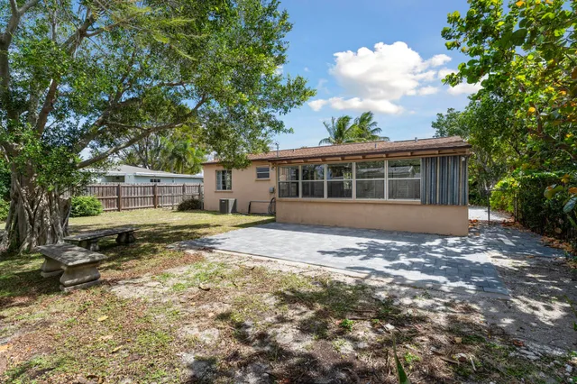 a swimming pool with wooden fence