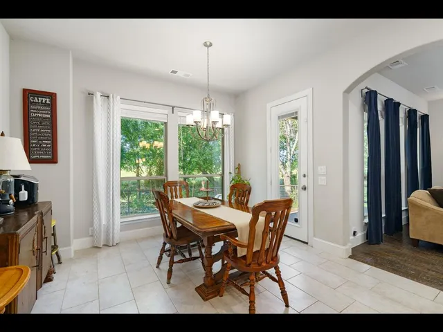 a large kitchen with cabinets a sink and a stove
