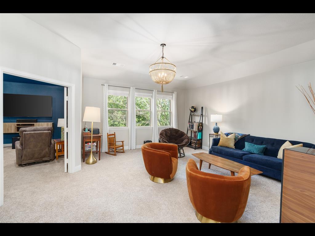 191 Daniel Drive Van Alstyne, TX 75495 - Photo 20 of 32 a living room with furniture and a flat screen tv