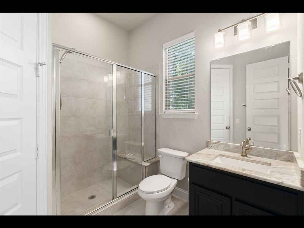 191 Daniel Drive Van Alstyne, TX 75495 - Photo 7 of 32 a bathroom with a sink toilet and shower