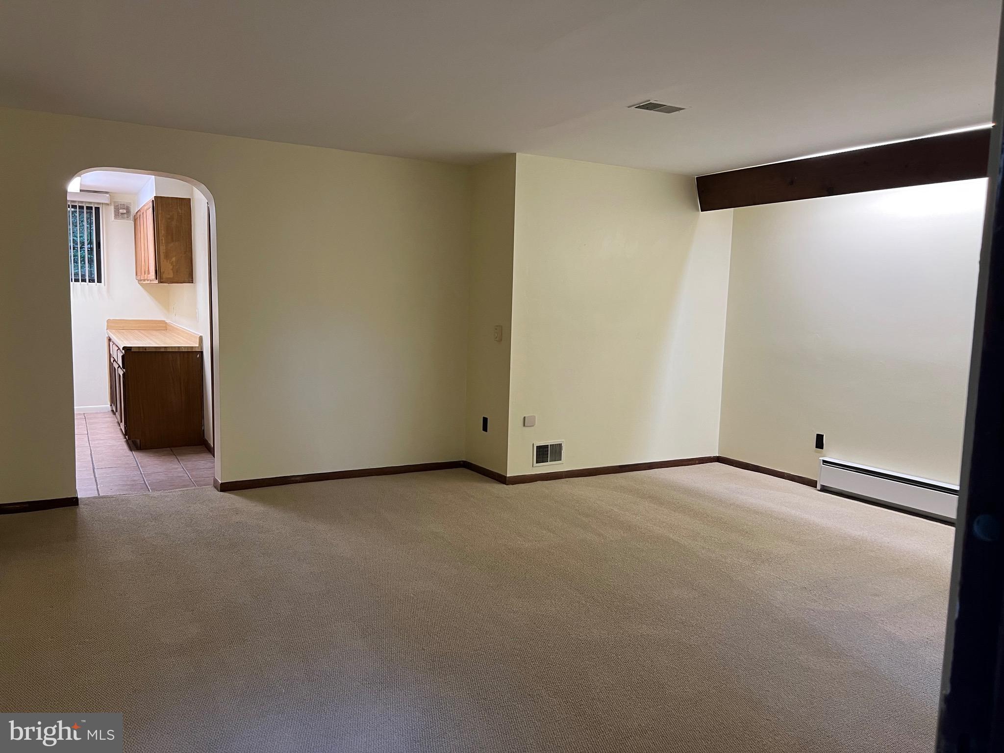 707 Schindler Drive Silver Spring, MD 20903 - Photo 2 of 8 a view of an empty room with a window