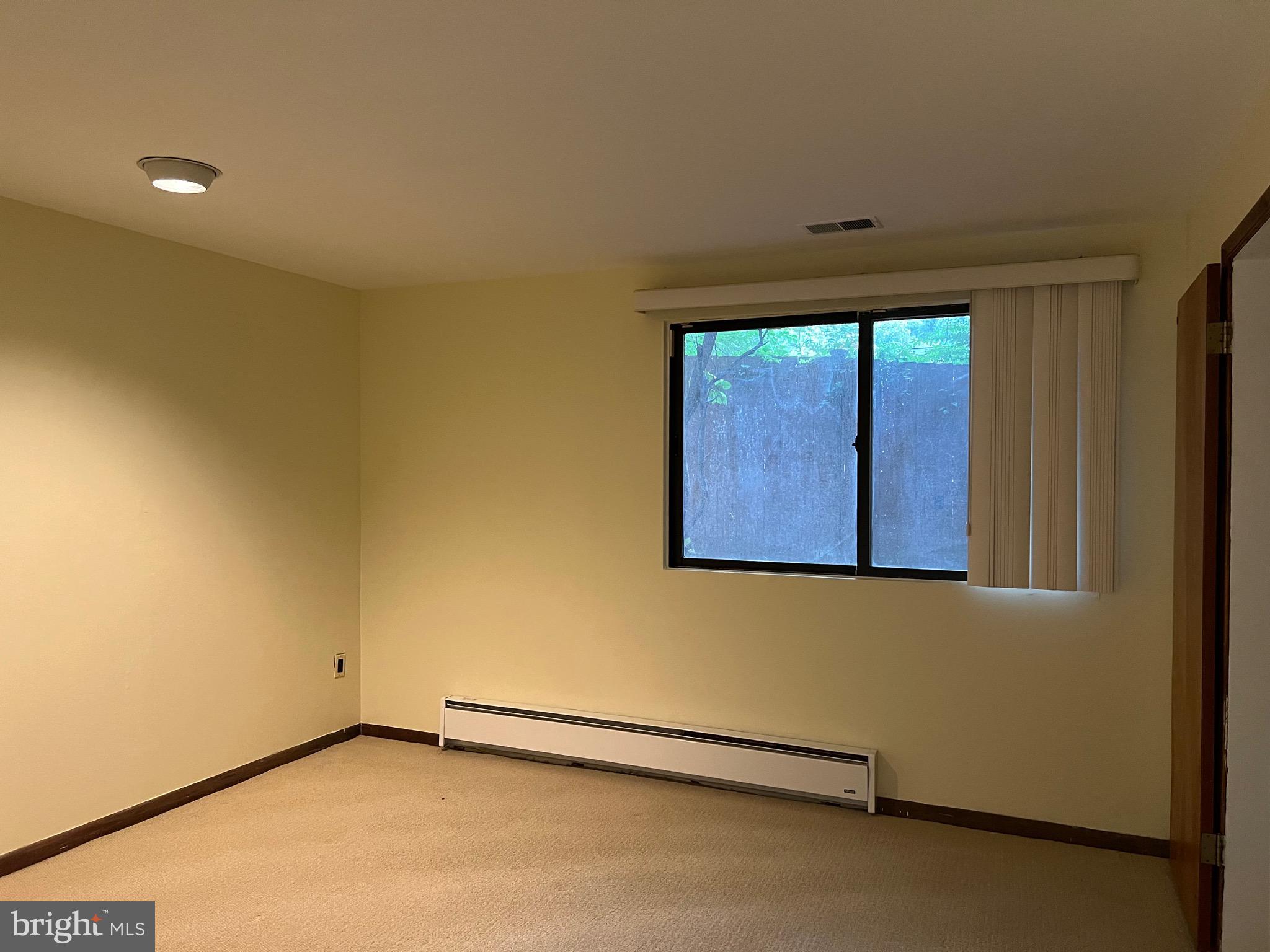 707 Schindler Drive Silver Spring, MD 20903 - Photo 7 of 8 an empty room with windows