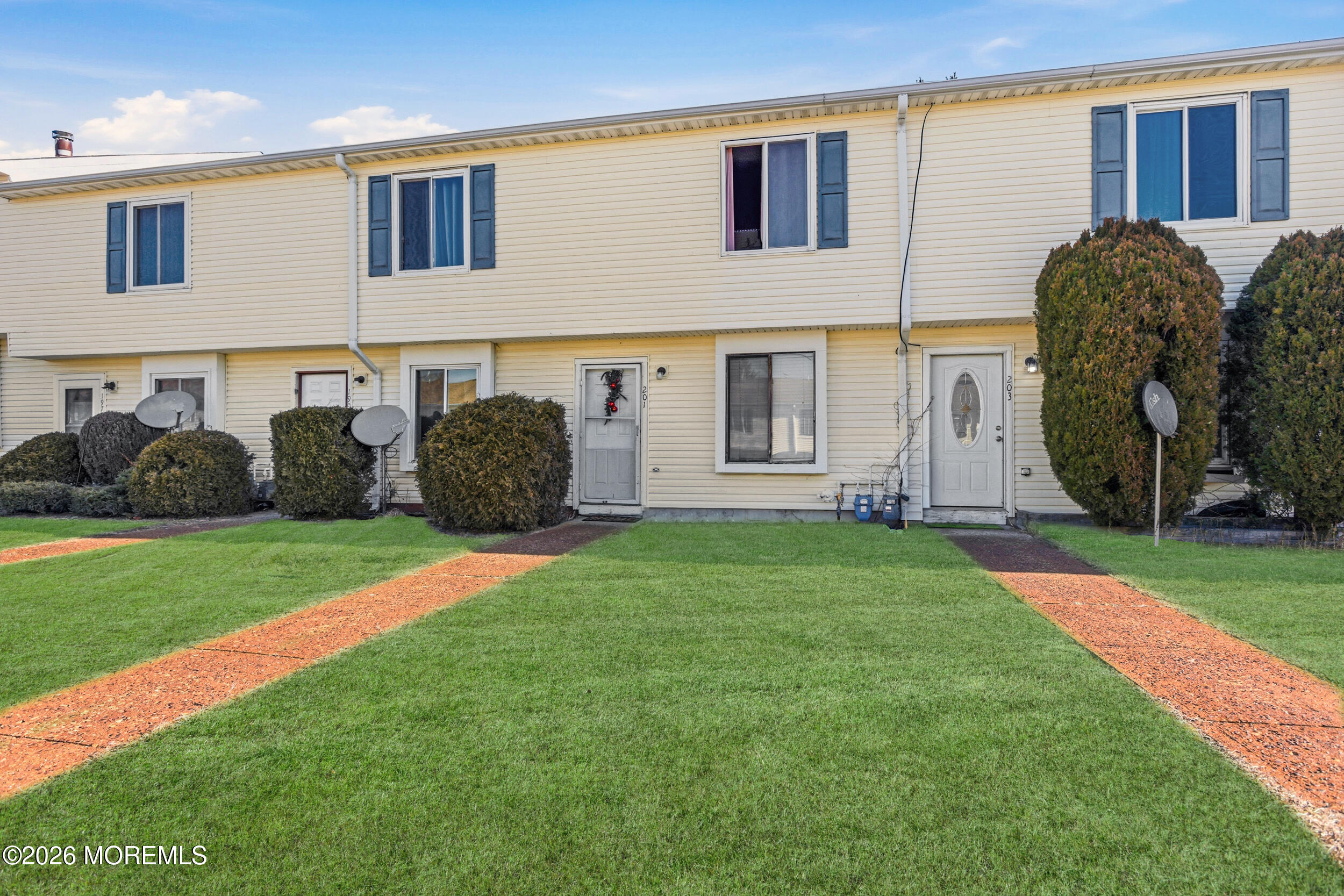 a view of a front of a house with a yard