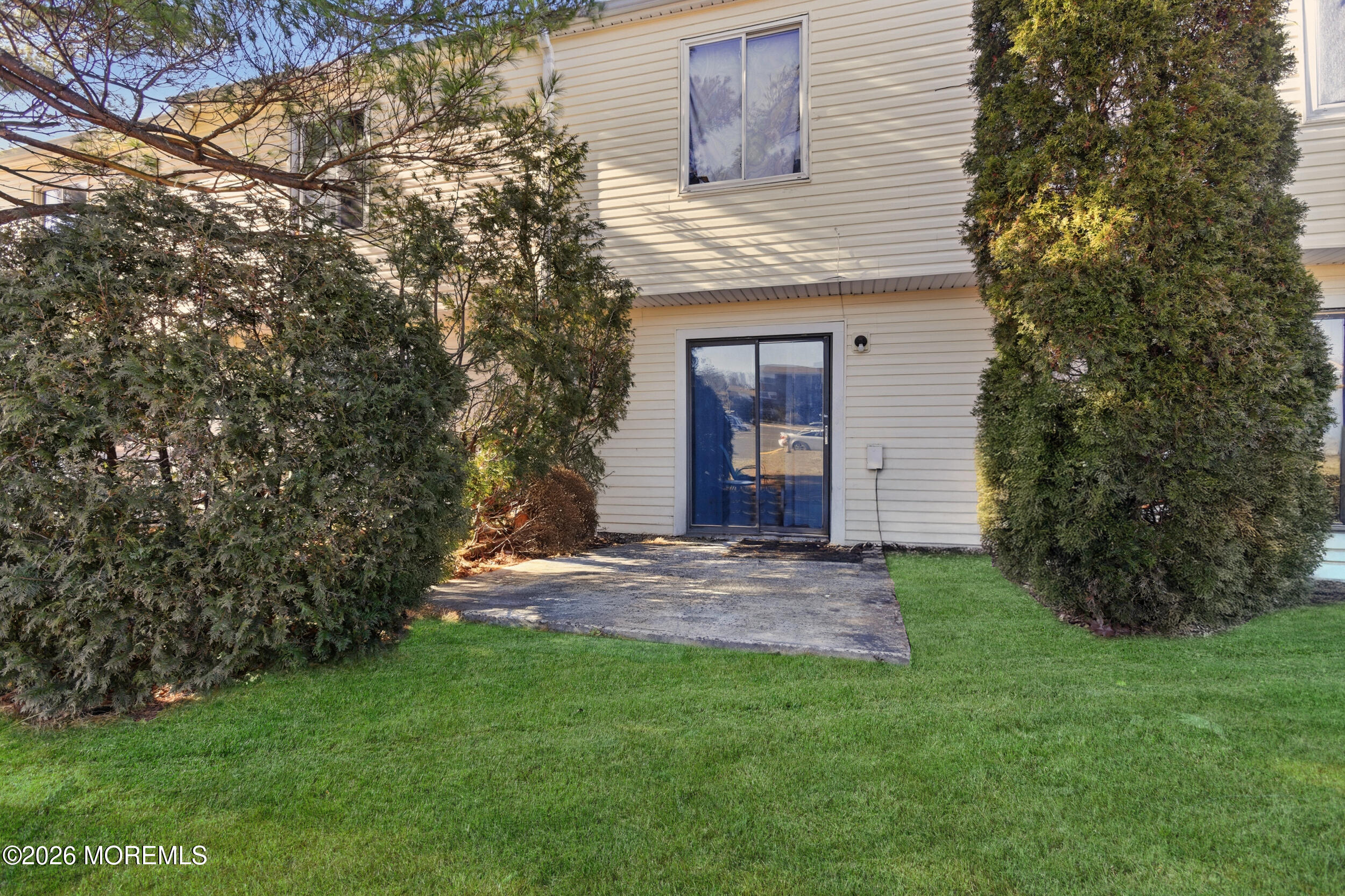 201 Sawmill Road Brick, NJ 08724 - Photo 15 of 17 a view of a yard in front of a house with plants and large tree
