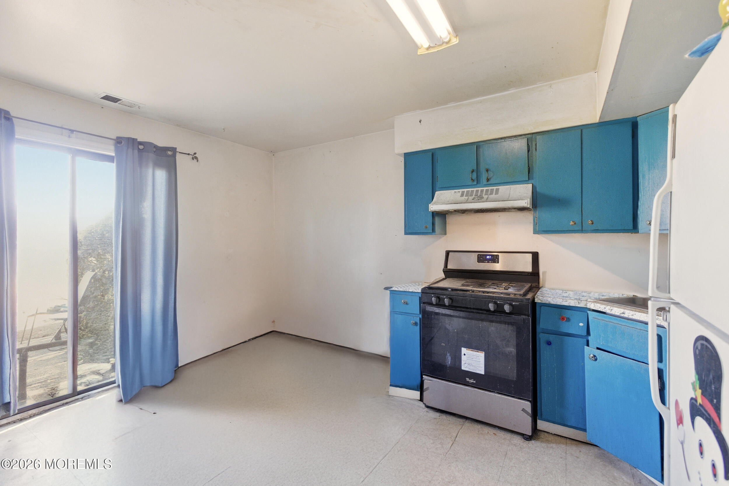 201 Sawmill Road Brick, NJ 08724 - Photo 7 of 17 a kitchen with a stove and a cabinet