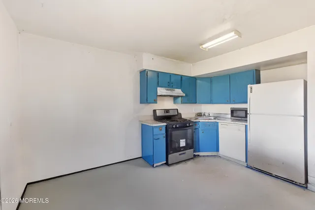 a kitchen with stainless steel appliances granite countertop a refrigerator stove a sink and dishwasher