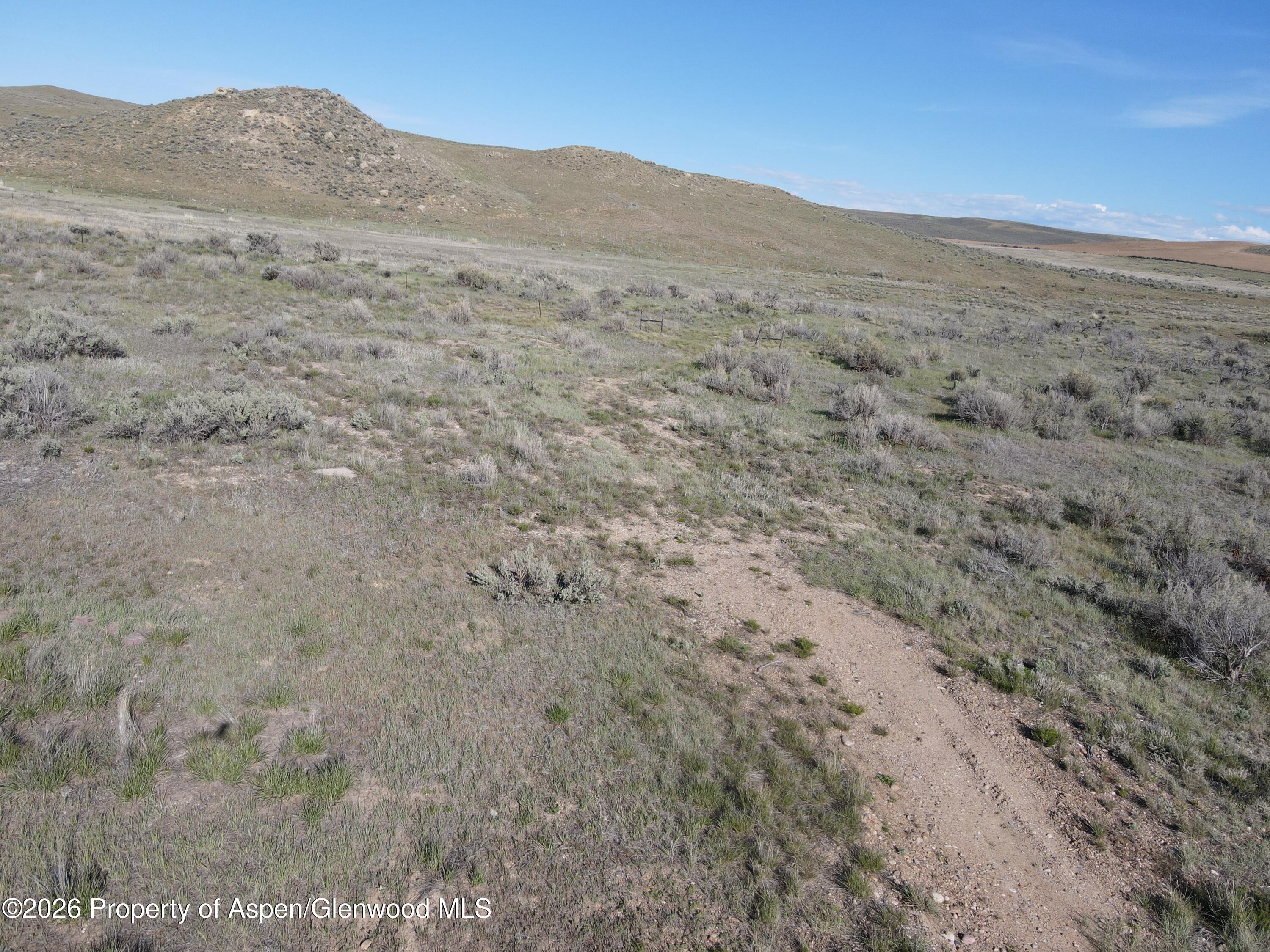 40 Highway 40 Craig, CO 81625 - Photo 46 of 46 a view of a dry yard with mountains in the background