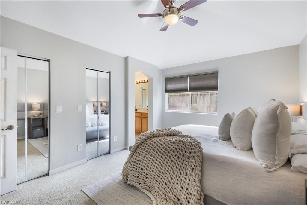 10004 Ravello Boulevard Fort Myers, FL 33905 - Photo 15 of 42 a bedroom with a large bed and a chandelier