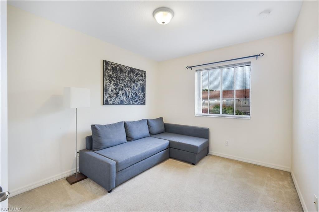 10004 Ravello Boulevard Fort Myers, FL 33905 - Photo 19 of 42 a living room with furniture and a window