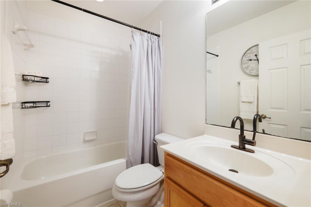 10004 Ravello Boulevard Fort Myers, FL 33905 - Photo 20 of 42 a bathroom with a sink toilet and shower