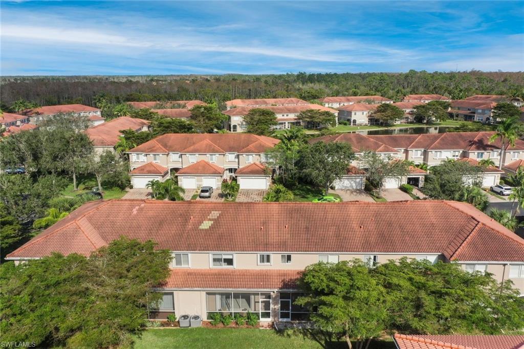 10004 Ravello Boulevard Fort Myers, FL 33905 - Photo 34 of 42 an aerial view of residential houses with outdoor space and lake view