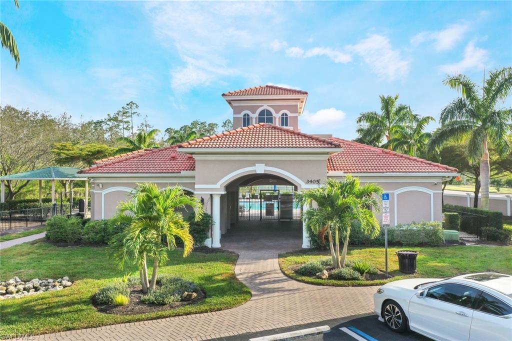 10004 Ravello Boulevard Fort Myers, FL 33905 - Photo 35 of 42 a front view of a house with a garden
