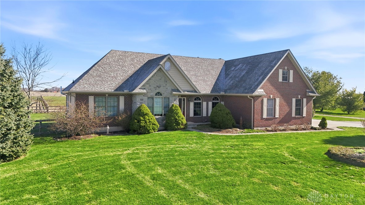 1540 Jasper Road Xenia, OH 45385 - Photo 2 of 91 A classic brick and stone residence with a neatly manicured lawn awaits new owners.