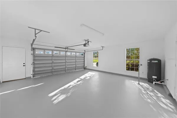 a view of a swimming pool and an outdoor seating