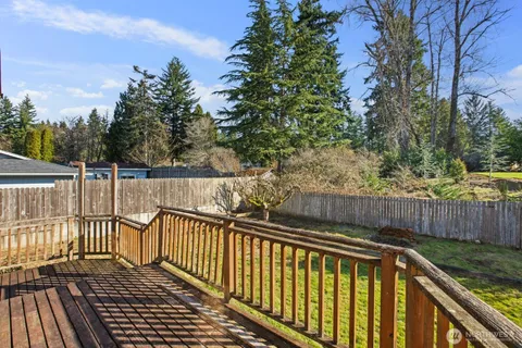 a view of balcony with wooden fence