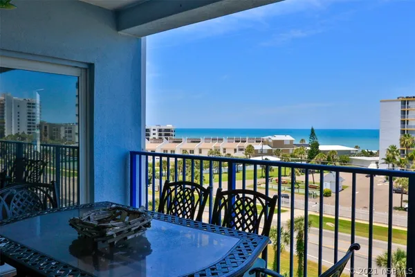 a view of a balcony with chairs