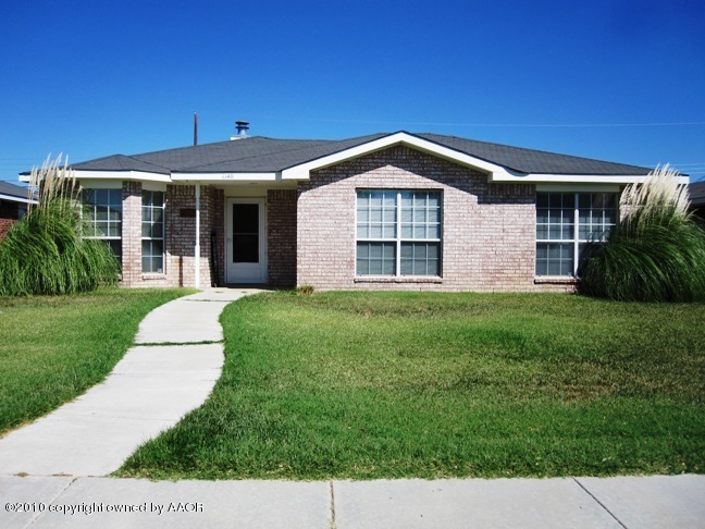 1140 Shasta Drive Amarillo, TX 79110 - Photo 1 of 23 a front view of a house with a yard