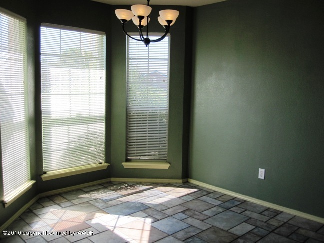 1140 Shasta Drive Amarillo, TX 79110 - Photo 6 of 23 a view of an empty room and window